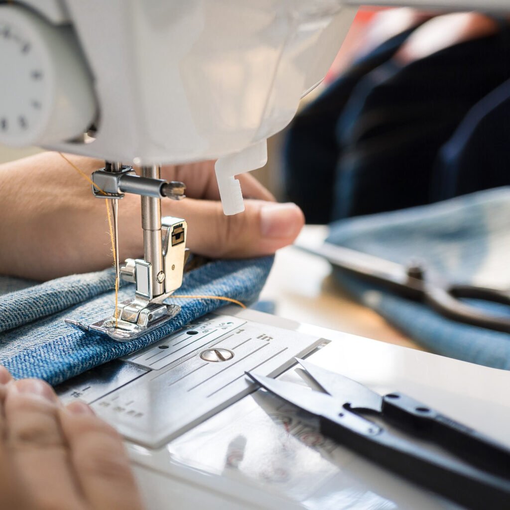 Skilled tailor stitching custom sportswear in Leocid Sports production unit